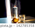 Refreshing water bottle glass and lemon for hydration 142785358