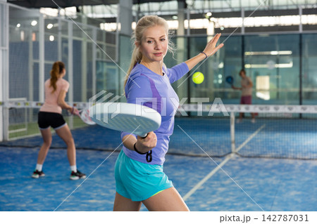 European woman playing padel European woman playing padel 142787031