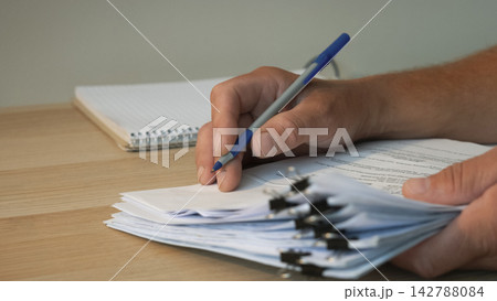 Businessman signing official contract at desk Businessman signing official contract at desk 142788084