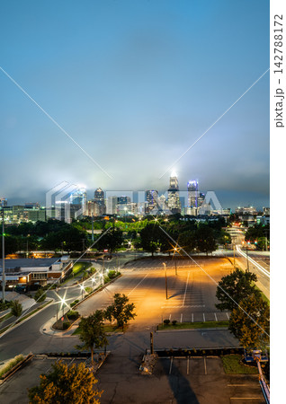 Illuminated Charlotte skyline under low clouds at night Illuminated Charlotte skyline under low clouds at night 142788172