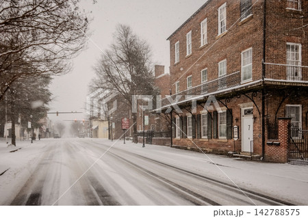 Rare Snowstorm in York South Carolina Covering Historic Downtown Main Street with Shops Benches and Winter Weather Conditions Rare Snowstorm in York South Carolina Covering Historic Downtown Main Street with Shops Benches and Winter Weather Conditions 142788575