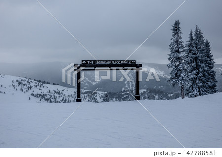 Vail Legendary Back Bowls Sign in Colorado with Snow Covered Mountain Landscape and Low Visibility Winter Conditions Vail Legendary Back Bowls Sign in Colorado with Snow Covered Mountain Landscape and Low Visibility Winter Conditions 142788581