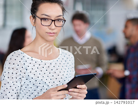 Woman, tablet and serious in office working for agency, coworking workplace and online or startup business website. Review, planning and social networking and job, browse and company information Woman, tablet and serious in office working for agency, coworking workplace and online or startup business website. Review, planning and social networking and job, browse and company information 142791017