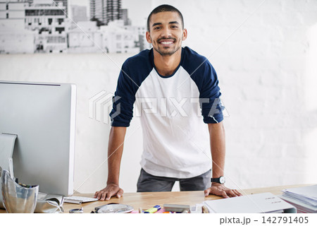 African man, home office and leaning on desk in portrait for career, web designer with computer for job. Male creative, table and happiness for remote work or startup, tech for website development African man, home office and leaning on desk in portrait for career, web designer with computer for job. Male creative, table and happiness for remote work or startup, tech for website development 142791405