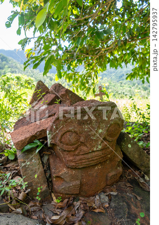 Tiki statue in the old cemetery of Atuona, Hiva Oa, French Polynesia Tiki statue in the old cemetery of Atuona, Hiva Oa, French Polynesia 142795937