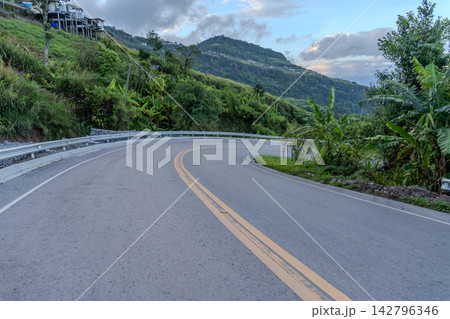 Winding downhill road at Thailand, photographed from the driver's perspective while driving. Winding downhill road at Thailand, photographed from the driver's perspective while driving. 142796346