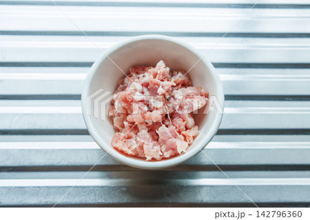 Minced pork in a small bowl. Minced pork in a small bowl. 142796360