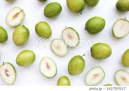 Green jujube fruits on white background. Green jujube fruits on white background. 142797017