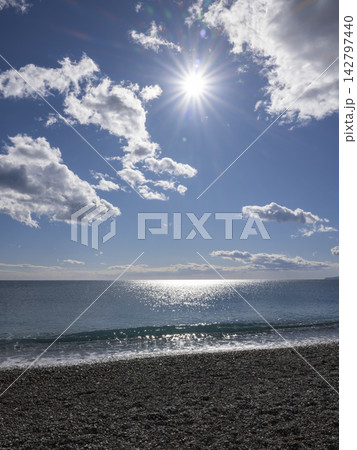 Dramatic cloudy sky and tranquil sea Dramatic cloudy sky and tranquil sea 142797440