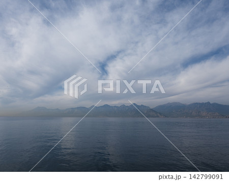 Calm sea under approaching storm clouds Calm sea under approaching storm clouds 142799091