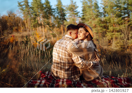 Stylish couple walking and enjoying autumn weather. People, lifestyle, vacations concept. Autumn. Stylish couple walking and enjoying autumn weather. People, lifestyle, vacations concept. Autumn. 142801927