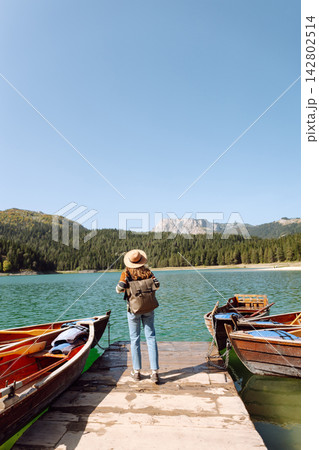 Young woman admiring the landscape nature on the embankment. The concept of travel, vacation 142802514