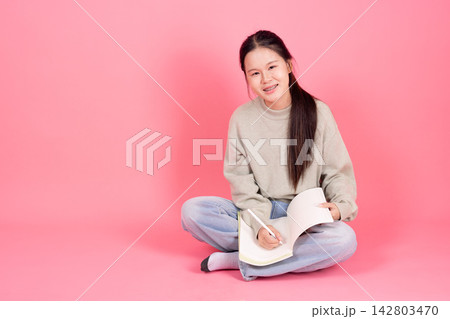 Asian Student Girl Sitting Reading Book College Education Studio Background 142803470