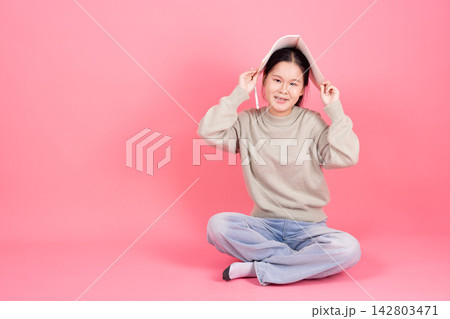Happy Smiling Cute Lovely Asian Student Girl Sitting with Book College Education Studio Background Happy Smiling Cute Lovely Asian Student Girl Sitting with Book College Education Studio Background 142803471