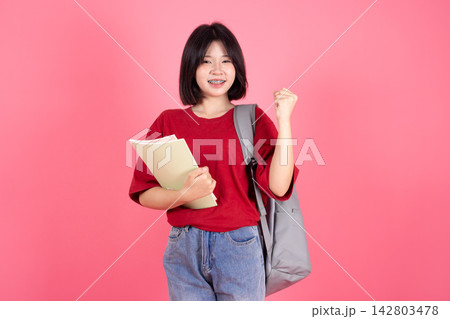 Asian Student Girl Raised Fist Victory Success College Education Studio Background Asian Student Girl Raised Fist Victory Success College Education Studio Background 142803478