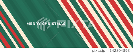 Merry Christmas banner design with abstract diagonal red and green candy cane stripes Merry Christmas banner design with abstract diagonal red and green candy cane stripes 142804898
