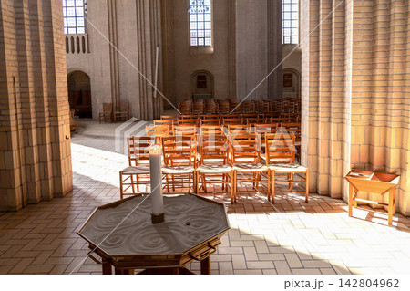 Grundtvig Church interior with minimalist architecture and soft natural light in Copenhagen Denmark. Grundtvig Church interior with minimalist architecture and soft natural light in Copenhagen Denmark. 142804962