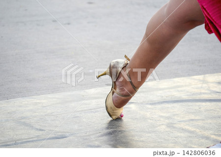 Woman Dancing Tango in High Heel Shoes on Outdoor Stage 142806036