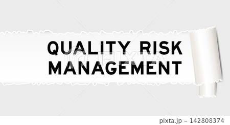 Ripped gray paper background that have word quality risk management under torn part Ripped gray paper background that have word quality risk management under torn part 142808374