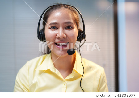 Smiling Customer Service Representative Wearing Headset 142808977