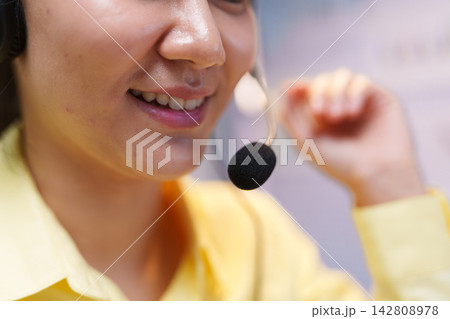Smiling Customer Service Assistant Wearing Headset Smiling Customer Service Assistant Wearing Headset 142808978