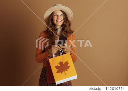 Elegant Woman with Autumn Shopping and Phone Elegant Woman with Autumn Shopping and Phone 142810734