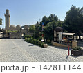 Morning market on the square. There are trading tents. Old square with a tent of fruit for sale. 142811144