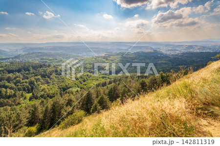 View of the mountains and Kislovodsk from the observation decks of the Kislovodsk Park. Evening sunset over the mountains of Kislovodsk. 142811319