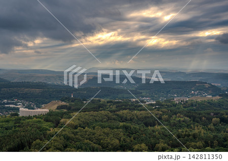 View of the mountains and Kislovodsk from the observation decks of the Kislovodsk Park. Evening sunset over the mountains of Kislovodsk. View of the mountains and Kislovodsk from the observation decks of the Kislovodsk Park. Evening sunset over the mountains of Kislovodsk. 142811350