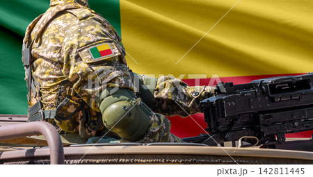 Benin flag with soldier at machinegun turret Benin flag with soldier at machinegun turret 142811445
