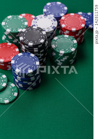 Multi colored gaming chips for betting in casino games. Betting chips Multi colored gaming chips for betting in casino games. Betting chips 142811759