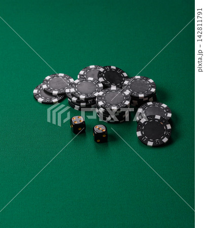 Multicolored casino chips as a conceptual backdrop for gambling games like poker, blackjack 142811791