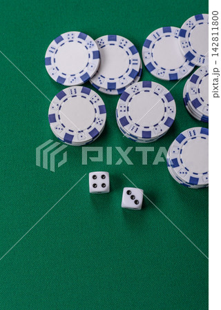 Multicolored casino chips as a conceptual backdrop for gambling games like poker, blackjack Multicolored casino chips as a conceptual backdrop for gambling games like poker, blackjack 142811800