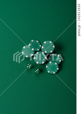 Multicolored casino chips as a conceptual backdrop for gambling games like poker, blackjack 142811810