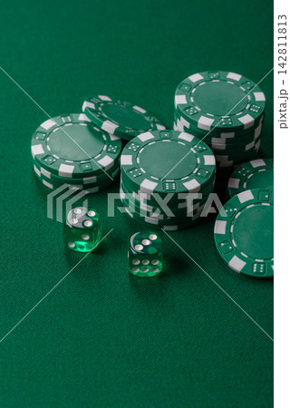 Multicolored casino chips as a conceptual backdrop for gambling games like poker, blackjack 142811813