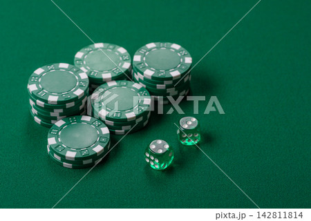 Multicolored casino chips as a conceptual backdrop for gambling games like poker, blackjack Multicolored casino chips as a conceptual backdrop for gambling games like poker, blackjack 142811814