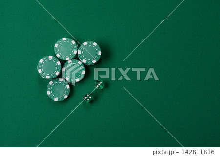 Multicolored casino chips as a conceptual backdrop for gambling games like poker, blackjack 142811816