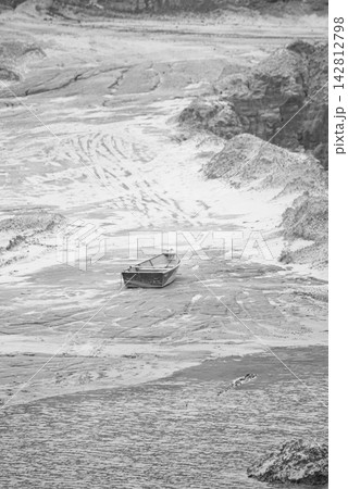 A sand mining operation in Brazil; a fantastic landscape rich in detail and color, featuring a sand mine in Brazil; selective focus. A sand mining operation in Brazil; a fantastic landscape rich in detail and color, featuring a sand mine in Brazil; selective focus. 142812798