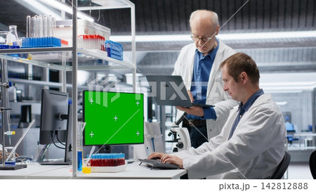 Green screen on computer display with colleagues working in biotechnology lab, using laboratory analysis, bioengineering and healthcare technology. Progress in pharmaceutical science. Green screen on computer display with colleagues working in biotechnology lab, using laboratory analysis, bioengineering and healthcare technology. Progress in pharmaceutical science. 142812888