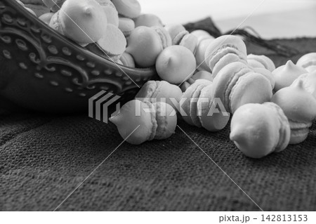 Brazilian sweet meringue, a delicious dessert made of eggs and sugar called "suspiro" in a city in Minas Gerais, Brazil, selective focus. Brazilian sweet meringue, a delicious dessert made of eggs and sugar called "suspiro" in a city in Minas Gerais, Brazil, selective focus. 142813153
