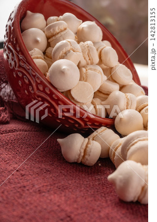Brazilian sweet meringue, a delicious dessert made of eggs and sugar called "suspiro" in a city in Minas Gerais, Brazil, selective focus. Brazilian sweet meringue, a delicious dessert made of eggs and sugar called "suspiro" in a city in Minas Gerais, Brazil, selective focus. 142813155