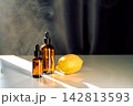 Essential oil dropper bottles with citrus lemon for aromatherapy 142813593
