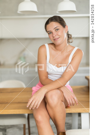 Young girl in shorts posing in kitchen at home 142814258