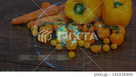 Displaying cluster of cherry tomatoes, yellow peppers, carrots on dark table, with blue overlay 142816909