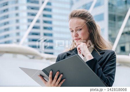 Professional Business woman Reading Document Folder Thinking Serious Expression Problem Solving Professional Business woman Reading Document Folder Thinking Serious Expression Problem Solving 142818008
