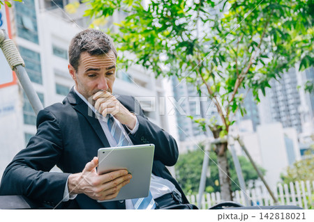 Businessman Stressed while Reading at Tablet Feel Worried Bad News Financial Loss Market Crash Anxiety Businessman Stressed while Reading at Tablet Feel Worried Bad News Financial Loss Market Crash Anxiety 142818021