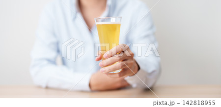 man with glass of Beer on table, suffering from alcohol addiction and alcoholism concept. depicting emotional distress, depression, substance abuse problem, unhealthy lifestyle and mental health man with glass of Beer on table, suffering from alcohol addiction and alcoholism concept. depicting emotional distress, depression, substance abuse problem, unhealthy lifestyle and mental health 142818955