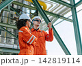 Refinery Engineers Woman Man Team Standing inspection in Industry Site Control Operate Plant job outdoors. 142819114