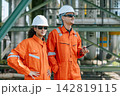 Refinery Engineers Woman Man Team Standing together in Industry Site Control Operate Plant job outdoors. 142819115