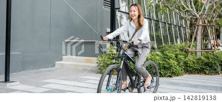young businesswoman with helmet riding bicycle go to office work young businesswoman with helmet riding bicycle go to office work 142819138